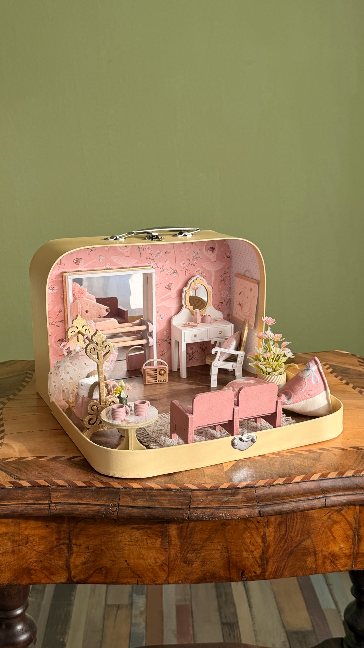 Tiny Ballerina medium suitcase dollhouse on an antique table, showing the fully furnished ballet room